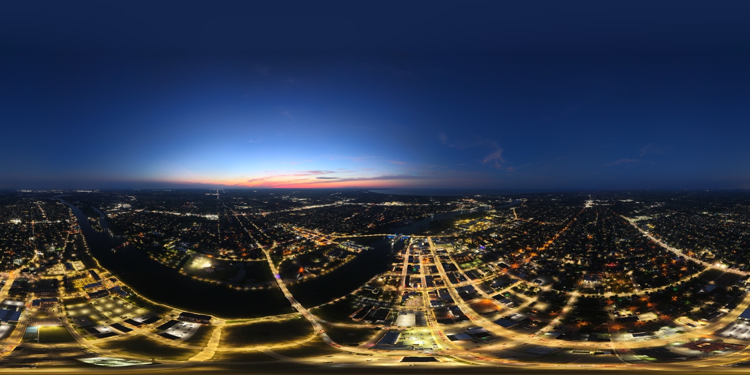 Equirectangular aerial panorama of Bay City and the Saginaw River after dark